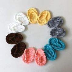 several crocheted slippers arranged in a circle