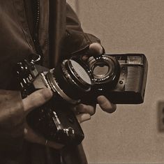 a person holding a camera in their hand