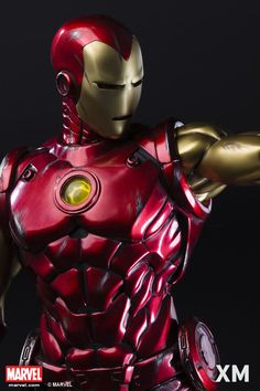 the iron man action figure is posed in front of a black background and has his arm outstretched