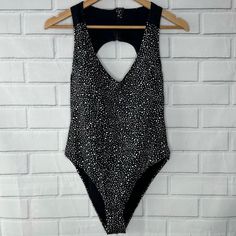 This Women's Nike Swimsuit Is Perfect For Any Water Activity. Product Details: - Size: Women’s Medium - Color: Black (With White Dot Print) - Mesh Insets Offer Breathability & Water Drainage - Large Open Keyhole Back - Scoop Neck - Dot Print - Zipper Back Closure - Light Bust Support - High-Leg Cut - Medium-Impact - Body: 83% Recycled Polyester | 17% Spandex - Lining: 100% Recycled Polyester - Trim: Nylon, Spandex - Machine Wash - Contains Recycled Materials - Contains Recycled Polyester Nike Swimsuit, Water Activity, Nike Swim, Swimsuit Black, Water Activities, Black Swimsuit, High Leg, Dot Print, Nike Black