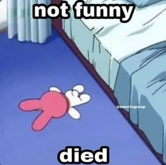 a cartoon character laying on the floor in front of a bed that says, not funny died