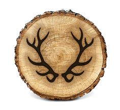 a piece of wood with antlers on it