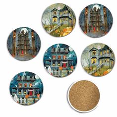 four coasters with houses and pumpkins on them