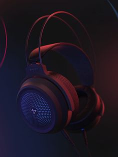 the headphones are red and black with blue lights on them in front of a dark background