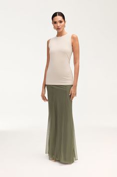 Indulge in elegance with our Milia Mesh Maxi Skirt in Smokey Olive. This skirt features intricate princess seam detailing and godets, making it a luxurious statement piece. The mesh material adds a touch of allure, making it perfect for any upscale event. Model is 5'7" and is wearing size S/44". Please note this garment runs tight. We kindly recommend choosing one size up from your usual size. Mesh Maxi Skirt, White Dress Formal, Dresses Flowy, Nikkah Dress, Engagement Dresses, Dress Satin, Kids Outerwear, Ribbed Dresses, Basic Dress