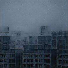 an abstract photograph of buildings in the fog