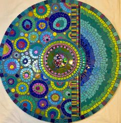 This is a handmade glass and Mixed Media mosaic wall art by Artist Valerie Watson. It is a 24" Round on MDF wood. This piece would be a beautiful addition to any room. It is titled "Overjoyed". please see the video in the listing to really see the brilliance. This piece is created using a variety of bright colors. It has many unique types of Stained Glass, art glass , tiles, resin, and lots of glass beads. It is grouted in green. it has a 100lb wire installed on the back and is ready to hang.You Glitter Tiles, Mosaic Inspiration, Mixed Media Mosaic, Mosaic Art Projects, Mosaic Tile Art, February 2025, Mosaic Artwork, Pouring Painting, Mosaic Wall Art