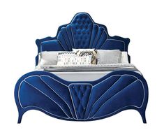 a blue bed with an intricate headboard and foot board is shown in this image