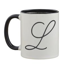 a black and white coffee mug with the letter g on it