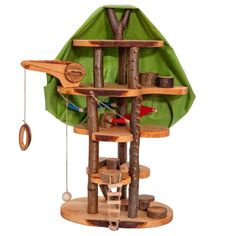 a bird house made out of wood and green fabric