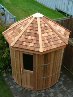 a small wooden building with a tiled roof