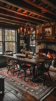 a dining room table and chairs in front of a fireplace