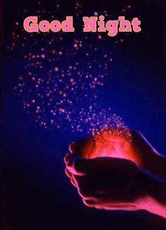 a hand holding a glowing ball with the words good night on it and stars in the background