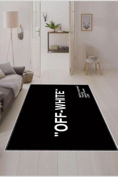 a black rug with the words off white on it