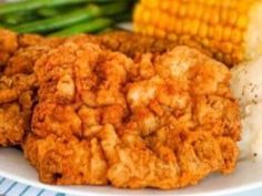 fried chicken, mashed potatoes and corn on the cob are served on a plate