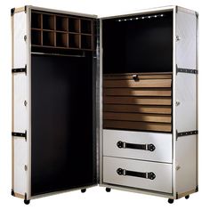 an open storage cabinet with drawers and lights