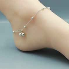 Sterling silver anklet with silver balls and tear drop charms. Comes with two 6mm bell. Length: 10 inches. Tear drop: 4 x 12 mm Ball: 3mm Price listed is for ONE piece. These anklets are made of 925 hypoallergenic sterling silver. All my pieces are sent in a gift box. I can include a personal message from you if needed. You are welcome to contact me at... bhavnakwintra1956@gmail.com More anklets https://www.etsy.com/shop/TheSilverGame?ref=seller-platform-mcnav&section_id=26713873 More hoops: Adjustable Silver Dangle Anklets, Silver Adjustable Dangle Anklets, Silver Dangle Metal Anklets, Silver Dangle Anklets, Payal Designs Silver, Silver Chain Anklet, Silver Anklets Designs, Silver Payal, Anklet Silver