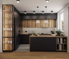 a modern kitchen with wooden cabinets and black counter tops, along with glass shelves on the wall