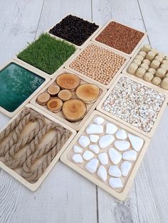 there are many different types of stones and wood on the floor with white boards around them