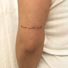 a woman with a tattoo on her arm that says,'time will tell '