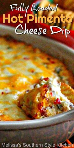 a casserole dish with cheese on top and the words fully loaded hot pinentoo cheese dip