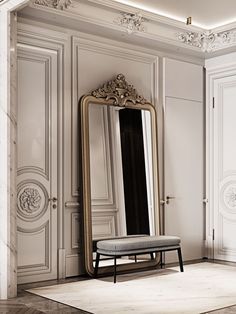 a large mirror sitting on top of a wooden floor next to a bench in front of a white wall