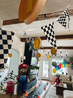 a room filled with lots of decorations and balloons