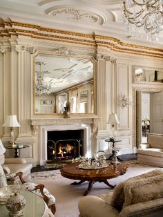 a living room filled with furniture and a fire place in the middle of a room