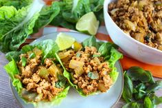 three lettuce wraps filled with meat and vegetables