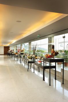 a buffet line with many different types of food on it's tables and benches