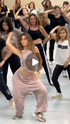 a group of young women dancing in a dance studio