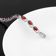 Introducing our Red Garnet Bracelet, a unique piece of jewelry that combines style and elegance. This handmade bracelet, crafted with 925 Sterling Silver, is more than just an accessory. It's a statement of sophistication, a testament to beauty, and a perfect gift for the special person in your life. Key Features: Red Garnet Gemstone: The bracelet features a captivating red garnet gemstone, known for its deep red color and its ability to inspire love and devotion. Birthstone Bracelet: Red Garnet Elegant Ruby Jewelry With Natural Stones, Elegant Jewelry With Garnet Natural Stones, Elegant Jewelry With Garnet And Natural Stones, Elegant Garnet Jewelry With Natural Stones, Red Sterling Silver Bracelet For Anniversary, Classic Ruby Bracelet As A Gift, Elegant Red Sterling Silver Bracelet For Anniversary, Elegant Red Sterling Silver Anniversary Bracelet, White Gold Ruby Bracelet As Gift