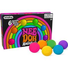 an assortment of neon colored balls in front of a box with the words see doh rainbow