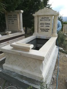 a cemetery with two headstones and a blue hose