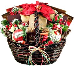 a basket filled with chocolates, candy and christmas decorations