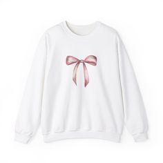 "Introducing our effortlessly chic \"Bow Sweatshirt\" - a must-have for those who appreciate the perfect fusion of comfort and style. This cozy sweatshirt embraces simplicity with a striking pink bow graphic that adds a touch of femininity to your casual wardrobe. Crafted from high-quality, soft fabric, it ensures a comfortable fit for all-day wear. The \"Bow Sweatshirt\" is more than just clothing; it's a statement piece. The minimalist design allows the eye-catching bow to take center stage, m Trendy Bows, Pink Bow Tie, Trendy Sweaters, Bow Design, Pink Sweatshirt, Cute Bows, Baby Bows, Retro Outfits, Pink Ribbon