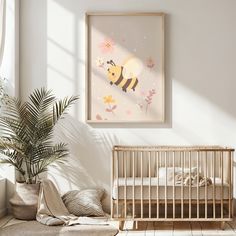 a baby's room with a bed, crib and potted plant