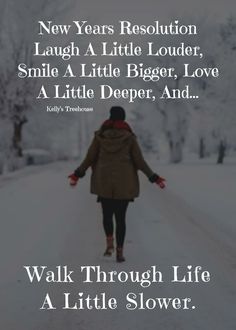 a woman walking down a snow covered road with the words walk through life a little slower