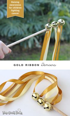 the ribbon is being made with gold ribbon and two different types of ribbons on it