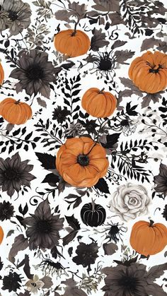 an orange and black floral pattern with pumpkins