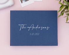 a blue wedding guest book with the word'the adresss'printed on it