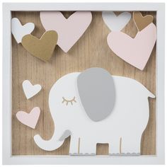 an elephant is surrounded by hearts in a shadow box on a wooden surface with white frame