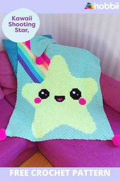 a crocheted star pillow sitting on top of a purple couch with the words kawaii shooting star