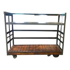 a metal and wood shelf with wheels