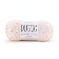 a white ball of yarn with pink and yellow sprinkles