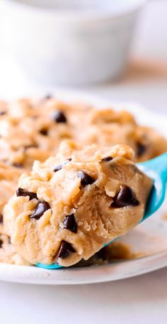 Delicious cookie dough with chocolate chips on a white plate