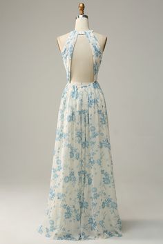 a dress on a mannequin with blue and white floral print in the back