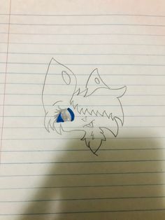 a drawing of a wolf's head on lined paper with a pencil in the foreground