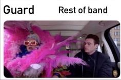 two people in a car with pink feathers on their head and the caption reads guard rest of band