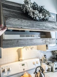 a stove top oven sitting inside of a kitchen